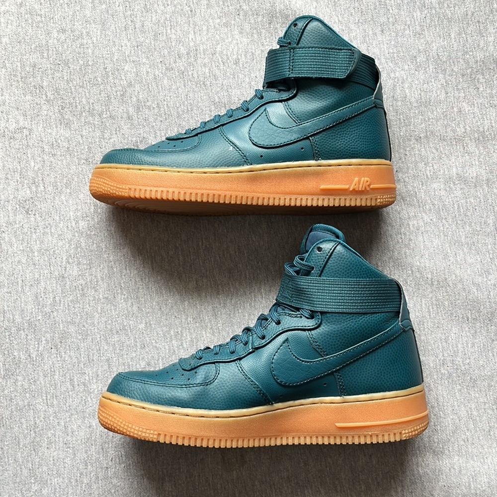 Nike high Air Force 1. Size 7.5. Worn once. Teal color. Yellow soles.